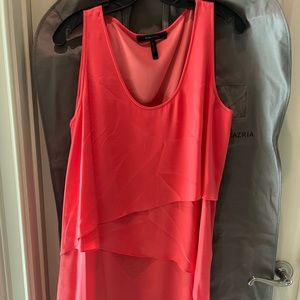 BCBG MaxAzria asymmetrical hem tiered dress in coral.